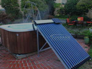 sunbank solar hot tub kit heating a hot tub in a backyard