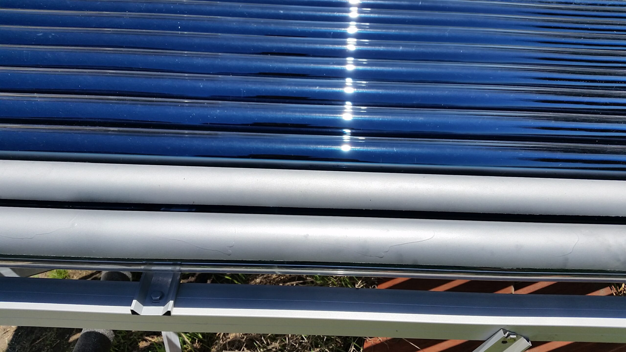 Evacuated tube solar collectors painted to turn off